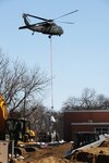 "Sand bombs" were delivered by a UH-60 helicopter to the Oak Grove Lutheran School in an effort to stop the water from flowing into the school on Sunday, March 29, 2009.