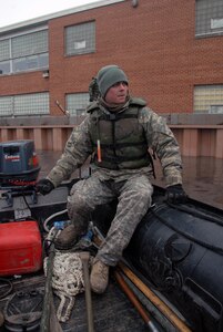 "He's just a good NCO," a leader recently said of Sgt. Matt J. Walstad, a member of the North Dakokta Army National Guard's 957th Liaison Monitoring Team out of Bismarck, N.D. His efforts, both by land and sea, have greatly contributed to Guardsmen's safety, as well as the flood-fighting efforts in Fargo, N.D. Here, Walstad responds by boat to reinforce the water side of the dike at Oak Grove Lutheran School in Fargo.