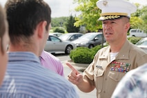 Brig. Gen. James Bierman, the commanding general of Marine Corps Recruit Depot San Diego and the Western Recruiting Region, talks to poolees of Recruiting Substation Independence, during an RSS visit, Aug. 7. Bierman toured the 9th Marine Corps District headquarters and RSS Independence and RSS Gladstone to meet and address local Marine recruiters.