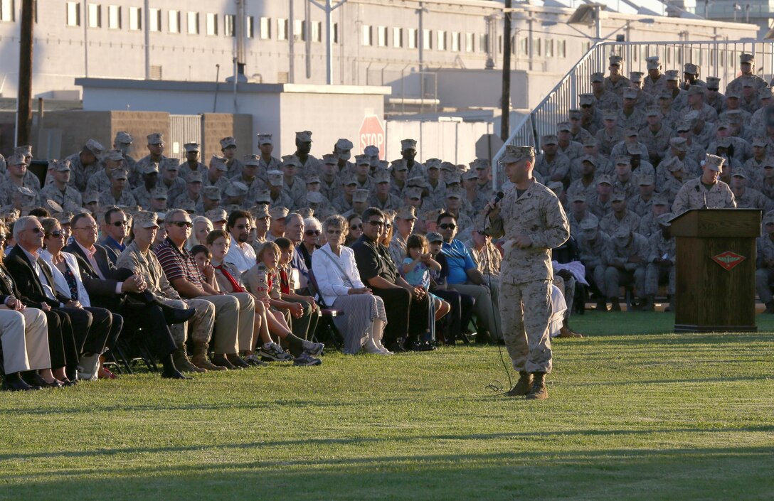 Sgt. Nicholas Lang, the reviewing officer for the ceremony and an intelligence analyst with the 3rd Marine Aircraft Wing, speaks to Marines, sailors and guests during an evening colors ceremony aboard Marine Corps Air Station Miramar, Calif., Aug. 6. During the ceremony Lang highlighted some of the services the San Diego Regional Chamber of Commerce has provided to the military.
