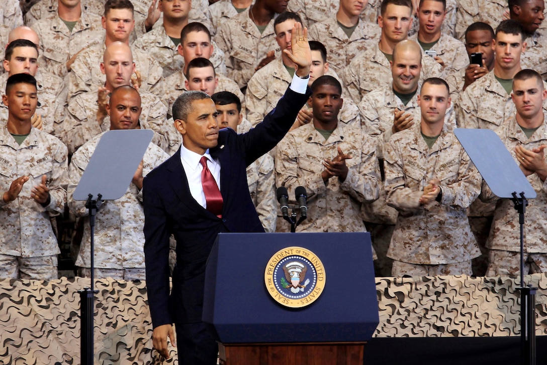 Commander in Chief, Barack Obama, waves to service members and their families after addressing them at the Marine Corps Air Station Camp Pendleton Aug.7. Obama spoke about the importance of the Marine Corps maintaining their amphibious roots as they withdraw from the war in Afghanistan.