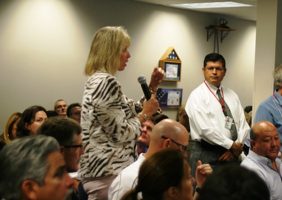 ALBUQUERQUE, N.M., -- A member of the audience asks a question during one of the sessions of the District's Small Business Industry Day, August 1, 2013.