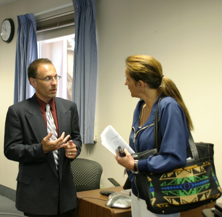 ALBUQUERQUE, N.M., -- Daniel Curado, the District’s deputy for small business, speaks with one of the attendees at the District's Small Business Industry Day, August 1, 2013.