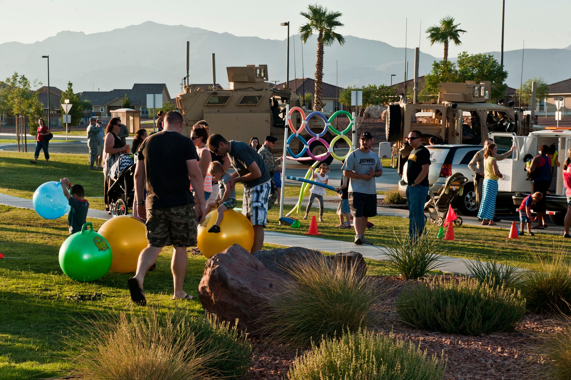 Nellis community members come together to enjoy family events at the Community Center where the 2013 Nellis National Night Out was held Aug 6, 2013, at Nellis Air Force Base, Nev. Nellis’ National Night Out had demonstrations from the 99th SFS Airmen, 99th Force Support Squadron’s Fire Department and Las Vegas Metro Police Department which included military working dogs, fire trucks and dirt bike patrols. National Night Out, which began as “America’s Night Out Against Crime,” in 1984, started an effort to promote involvement in crime prevention activities, police-community partnerships, neighborhood camaraderie to send a message to criminals letting them know that neighborhoods are organized and fighting back. National Night Out now involves over 37 million people and 15,000 communities from all fifty states, U.S. Territories, Canadian cities, and military bases worldwide. (U.S. Air Force photo by Senior Airman Daniel Hughes)