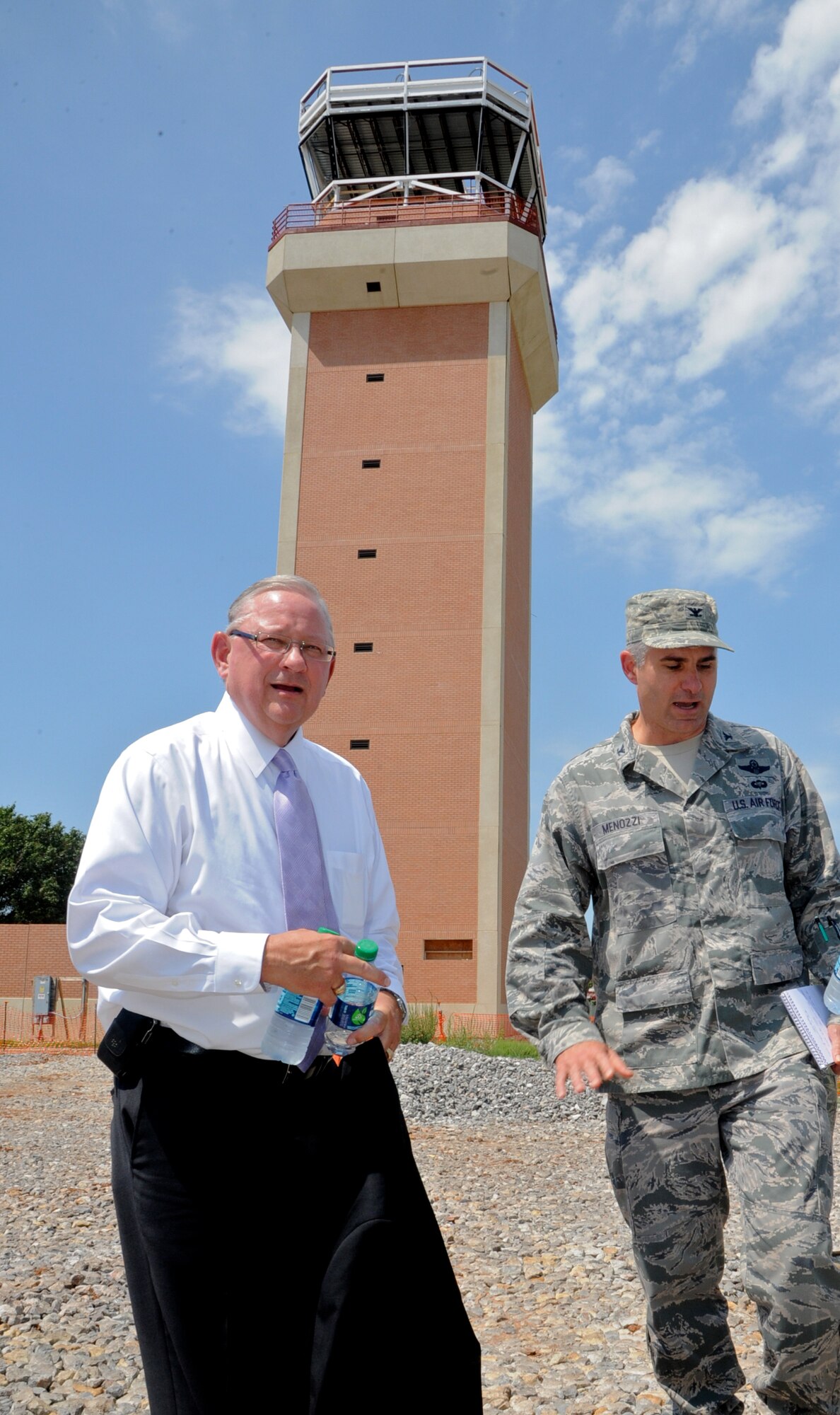 Mike Cooper, chairman of Oklahoma Military Strategic Planning Commission, left, and Col. John Menozzi, 71st Flying Training Wing vice commander, tour the new control tower construction site with staff members of the Senate Armed Services Committee during their visit Aug. 5 to Vance Air Force Base, Okla. (U.S. Air Force photo/ Senior Airman Frank Casciotta)