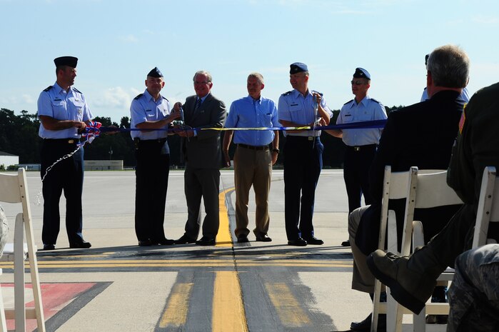 Joint Base Charleston leadership cut the ribbon during the opening of new Joint Base Charleston Runway Aug. 7, 2013, at JB Charleston – Air Base, S.C. (From left to right) Lt. Col. Patrick Miller, 628th Civil Engineer Squadron commander, Col. Richard McComb, Joint Base Charleston commander, Andrew Savage, Charleston County Aviation Authority chairman, Doug Marquart, DWG & Associates, Col. Darren Hartford, 437th Airlift Wing commander, and Col. James Fontanella, 315th Airlift Wing commander. The newly constructed runway is 9,000 feet long and 150-feet wide and 18-inches thick at a cost approximately $40 million. The runways at JB Charleston are part of a dual-use airfield and are shared with the Charleston County Aviation Authority and private industry.  The new runway will be capable of supporting Air Force mission requirements and also serve the local community. (U.S. Air Force photo/Airman 1st Class Chacarra Neal)