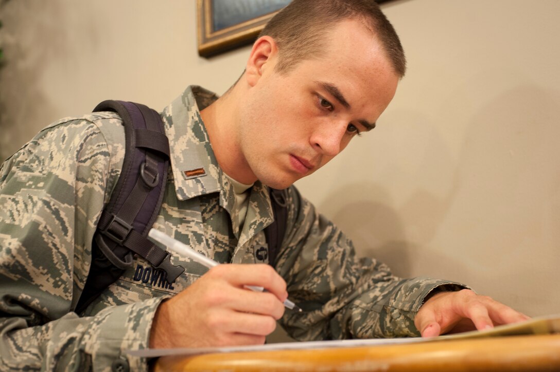 2nd Lt. Jeffery Downie, a recent U.S. Air Force Academy graduate, in-processes at Laughlin Air Force Base, Texas, Aug. 6, 2013. Approximately 10 agencies came together and 10,000 man-hours were saved when the newly graduated lieutenants in-processed together. (U.S. Air Force photo/Senior Airman John D. Partlow)