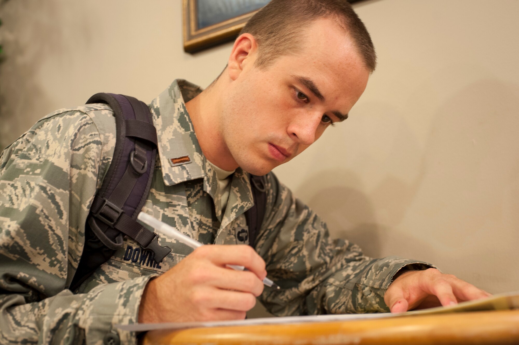 2nd Lt. Jeffery Downie, a recent U.S. Air Force Academy graduate, in-processes at Laughlin Air Force Base, Texas, Aug. 6, 2013. Approximately 10 agencies came together and 10,000 man-hours were saved when the newly graduated lieutenants in-processed together. (U.S. Air Force photo/Senior Airman John D. Partlow)