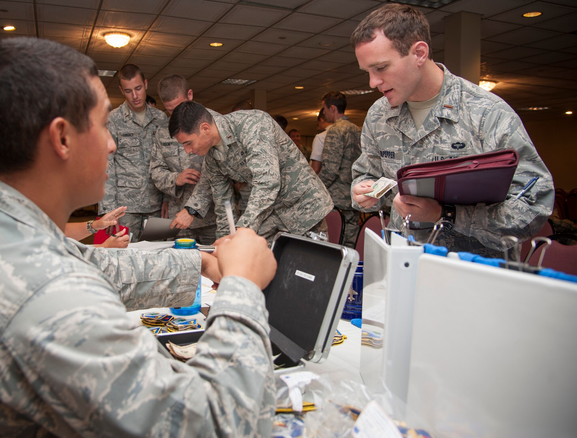 U.S. Air Force Academy graduates in process at Laughlin Air Force Base, Texas, Aug. 6, 2013. By in-processing the graduates together, Laughlin saves 10,000 man-hours, cutting down days of work. (U.S. Air Force photo/Senior Airman John D. Partlow)