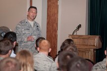 Col. Brian Hastings, 47th Flying Training Wing commander, briefs new U.S. Air Force Academy graduates before they in-process at Laughlin Air Force Base, Texas, Aug. 6, 2013. Approximately 150 graduates processed through Laughlin to begin pilot training. (U.S. Air Force photo/Senior Airman John D. Partlow)