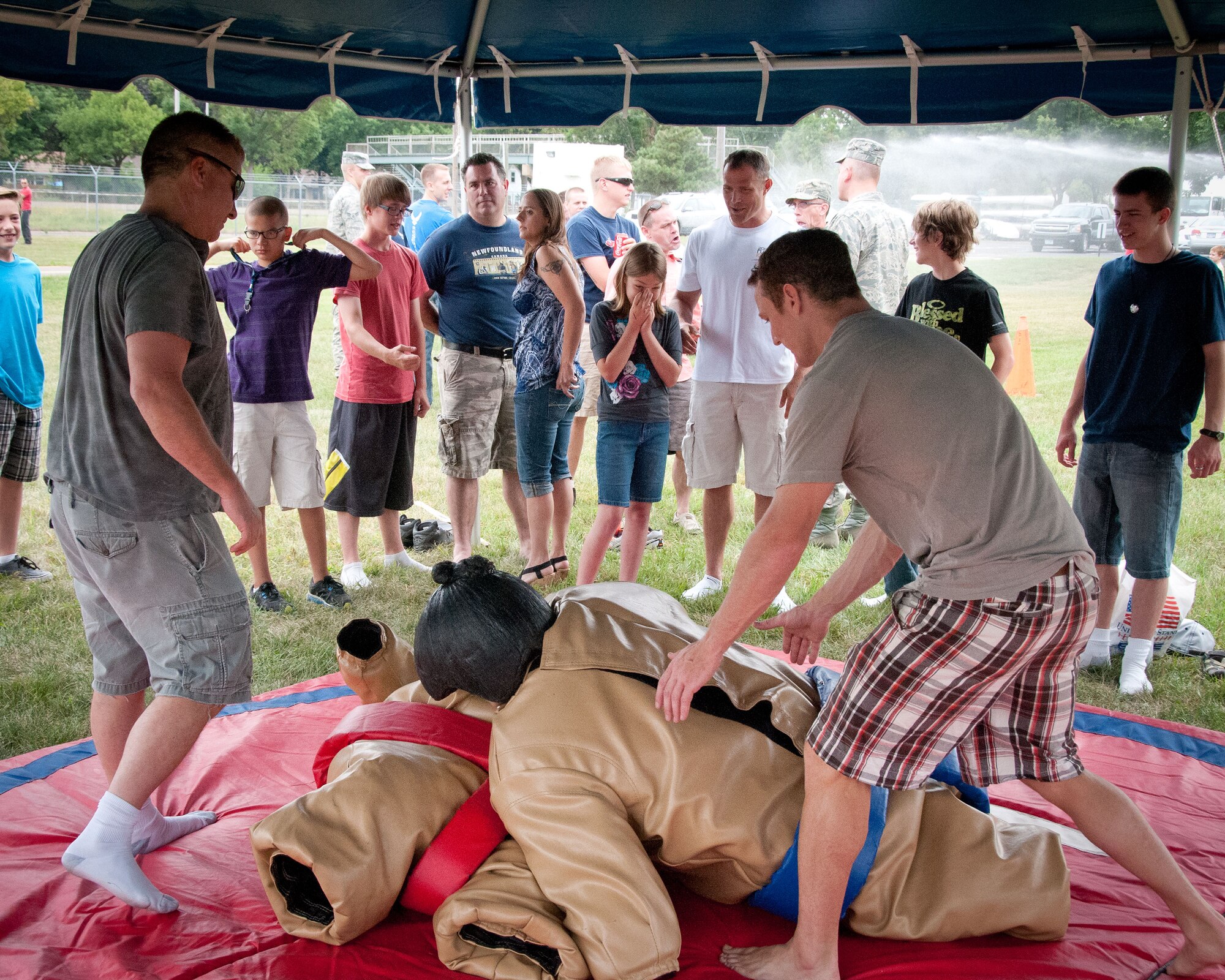 Friends and families of the 934th Airlift Wing Airmen come enjoy this year's Family Day festivites.  The annual event is an opportunity for the Airmen to invite their family out to the base for a picnic lunch, raffles, displays, and many other activities.  (U.S. Air Force photo/934th Airlift Wing Public Affairs)