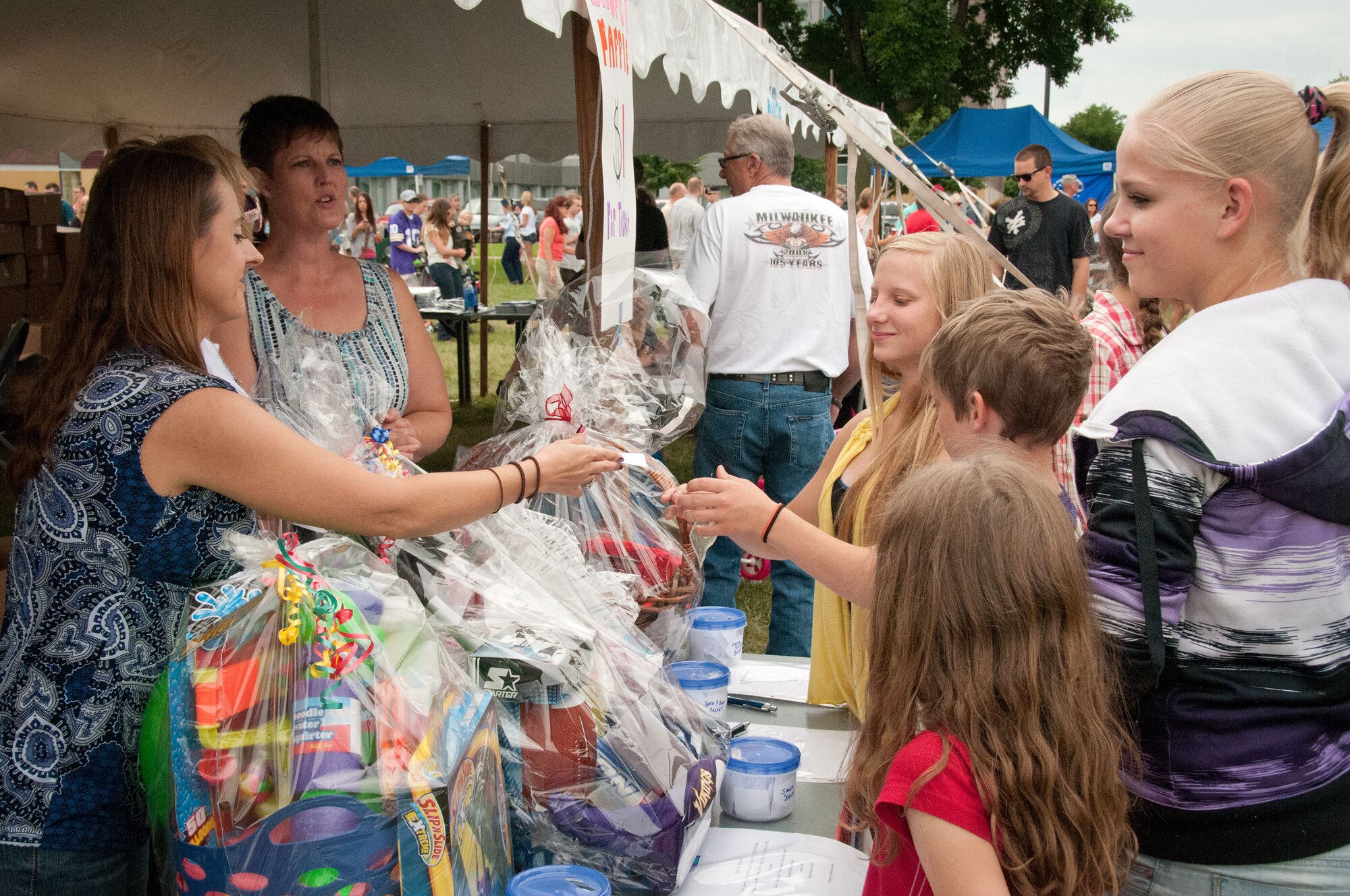Friends and families of the 934th Airlift Wing Airmen come enjoy this year's Family Day festivites.  The annual event is an opportunity for the Airmen to invite their family out to the base for a picnic lunch, raffles, displays, and many other activities.  (U.S. Air Force photo/934th Airlift Wing Public Affairs)