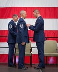 Maj. Lance Goette, 934th Maintenance Squadron executive officer, presents Master Sgt. Thomas Donnely with his Meritorious Service Medal at his retirement ceremony during the August Unit Training Assembly weekend.  (U.S. Air Force photo/SrA Trevor Saylor)