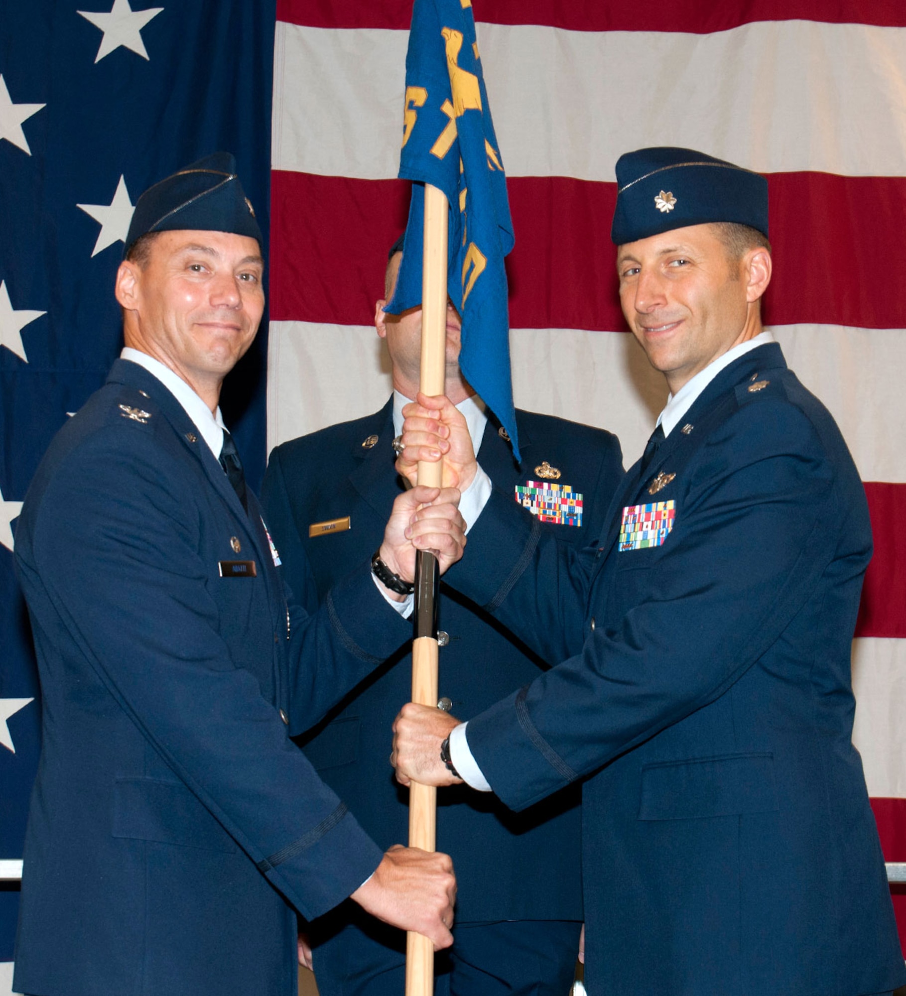 Lt. Col. William Maher, right, accepts the 71st Student Squadron guidon from Col. James Abatti, 71st Operations Group, during a change of command ceremony held June 26 at Vance Air Force Base, Okla. (U.S. Air Force photo/ Terry Wasson)