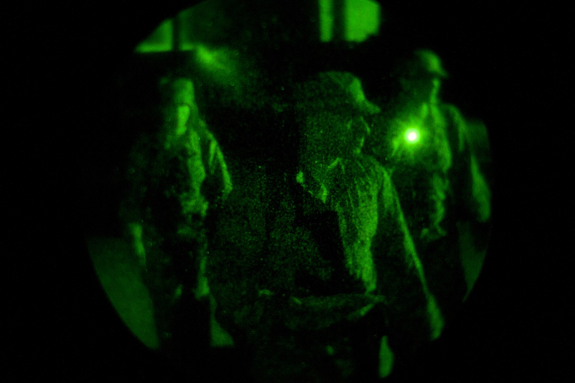 KUNSAN AIR BASE, Republic of Korea -- Senior Airman Dennis Petzold, 8th Civil Engineer Squadron exercise post-attack reconnaissance team lead, guides his team in an area sweep during an operational readiness exercise Aug. 8, 2013. After a building was “attacked” by mortars and they were given an “all clear,” a PAR sweep was initiated to ensure the area was safe and secure to continue operations. (U.S. Air Force photo by Senior Airman Armando A. Schwier-Morales/ Released)