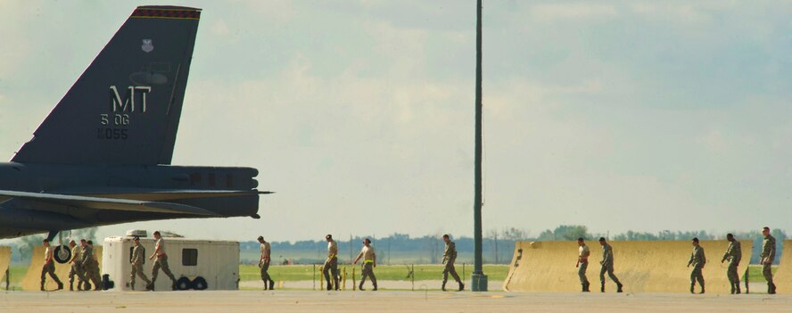 Before a B-52H Stratofortress leaves Minot Air Force Base, N.D., it must pass an inspection by a crew chief assigned to the 5th Aircraft Maintenance Squadron. Crew chiefs are responsible for ensuring the aircraft is in perfect working condition. They also perform scheduled inspections and preventive maintenance on B-52s and the equipment installed inside the aircraft. Crew chiefs also execute post-flight examinations to ensure the aircraft remains in ready condition. (U.S. Air Force photos/Senior Airman Brittany Y. Auld)