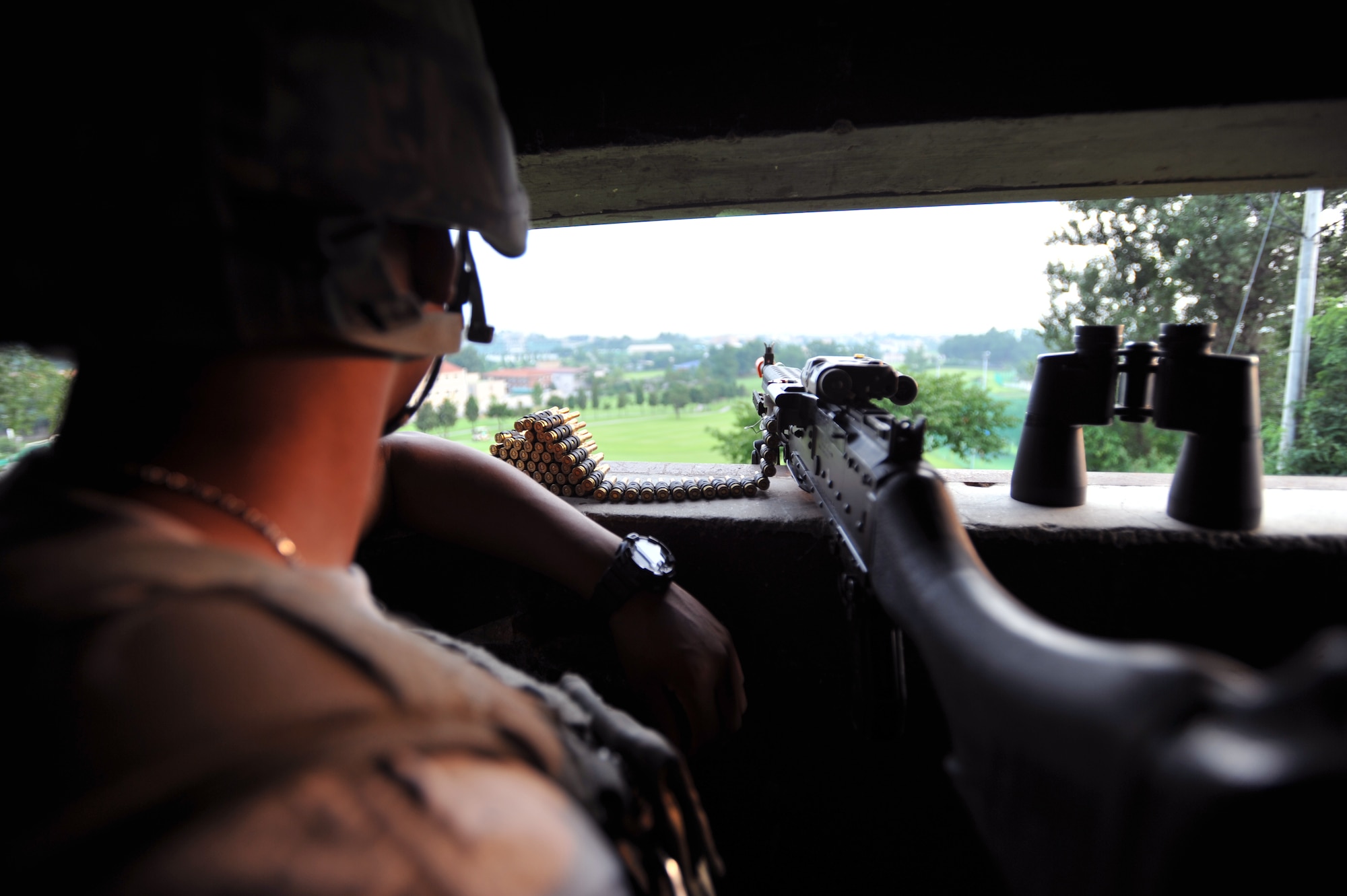 Airman 1st Class Robert Roland, 51st Security Forces Squadron entry controller, stands guard during Operational Readiness Exercise Beverly Midnight 13-03 at Osan Air Base, Republic of Korea, Aug. 7, 2013. Osan is in the fourth simulated wartime contingency exercise in 2013 that tests the base’s ability to defend and execute the mission in a heightened state of readiness. (U.S. Air Force photo/Senior Airman Siuta B. Ika)