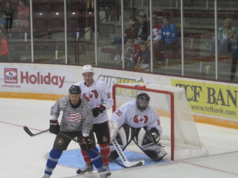 Team Canada Goalie Col. Cam LeBlanc is flanked by teammate #18 Jimmy O'Brien of the Ottawa Senators and Team USA  #22 Jeff Taffe of the Washington Capitals (Air Force Photo/Master Sgt. Al McCann)

