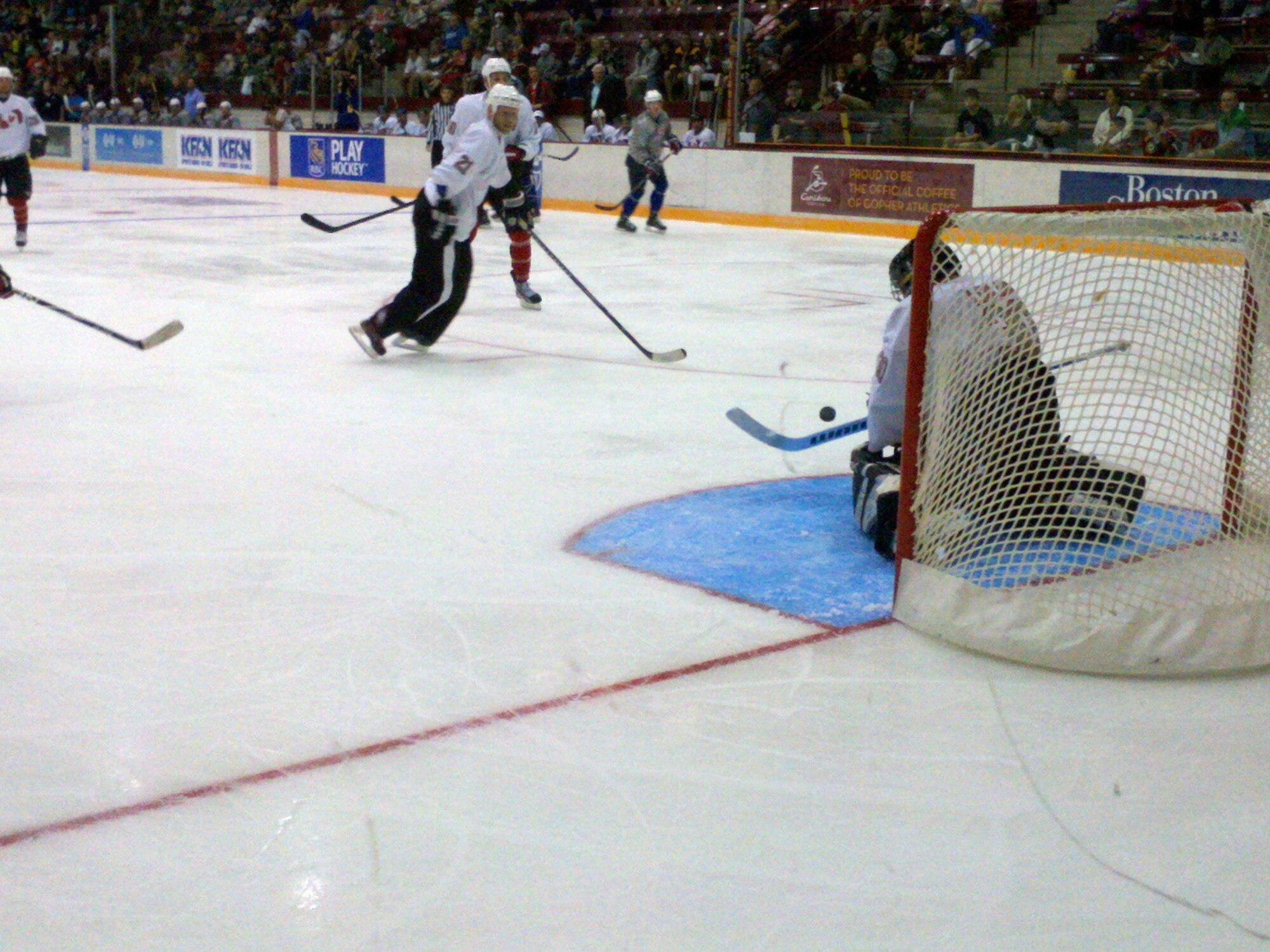 Col. Cam LeBlanc defends a shot on goal as teammates #21 Mark Parrish, Minnesota Wild Alumni and #18 Jimmy O'Bien of the Ottawa Senators, wait for the save. (Courtesy Photo)
