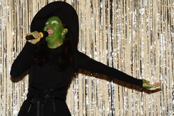 Airman 1st Class Sydney Manning, 1st Combat Camera Squadron videographer,  sings during the Air Mobility Command Icon Talent Contest Aug. 1, 2013, at Joint Base Charleston - Air Base, S.C. The AMC Icon program is loosely based on the hit TV program, “American Idol.” Manning, from Nampa, Idaho, performed Idina Menzel’s “The Wizard and I.” (U.S. Air Force photo/ Airman 1st Class Chacarra Neal)