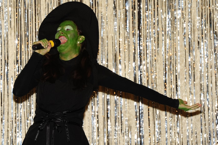 Airman 1st Class Sydney Manning, 1st Combat Camera Squadron videographer,  sings during the Air Mobility Command Icon Talent Contest Aug. 1, 2013, at Joint Base Charleston - Air Base, S.C. The AMC Icon program is loosely based on the hit TV program, “American Idol.” Manning, from Nampa, Idaho, performed Idina Menzel’s “The Wizard and I.” (U.S. Air Force photo/ Airman 1st Class Chacarra Neal)