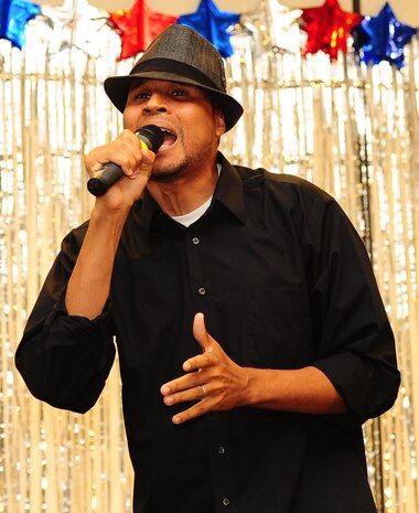 Master Sgt. Toby Housey, 315th Equal Opportunity advisor, performs during the Air Mobility Command Icon Talent Contest Aug. 1, 2013, at Joint Base Charleston - Air Base, S.C. The AMC Icon program is loosely based on the hit TV program, “American Idol.” Housey, from Estill, S.C., performed Maroon 5’s “Sunday Morning.” (U.S. Air Force photo/ Airman 1st Class Chacarra Neal)