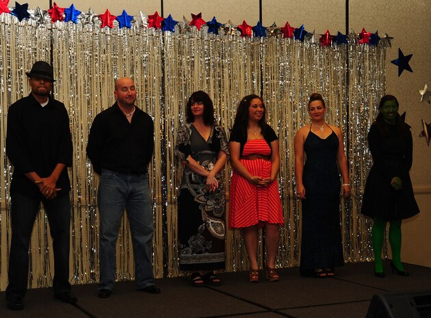 Contestants wait for the judges results during the Air Mobility Command Icon Talent Contest Aug. 1, 2013, at Joint Base Charleston - Air Base, S.C. All participants are equally eligible to win the base-level contests however, only AMC active duty Air Force members (to include AMC affiliate units (guard and reservists), will be permitted to represent their installations in the command finals.  The AMC Icon command finals are designated as an official AF function and as such is limited to AD participants.  The top rated participant from each base will be that installation’s representative in the command finals and a video of their performance will be forwarded to compete. (U.S. Air Force photo/ Airman 1st Class Chacarra Neal)