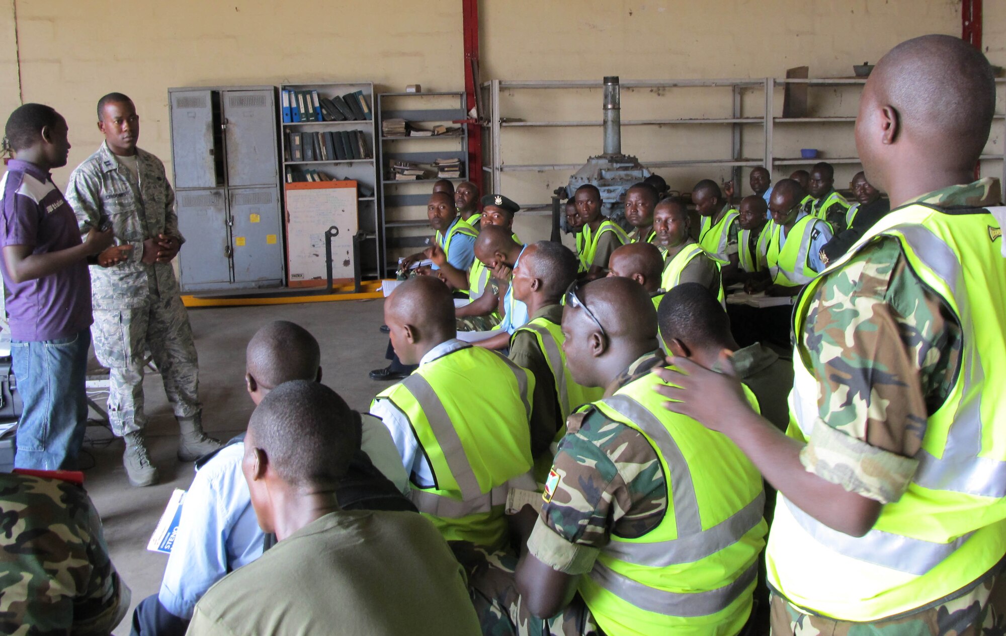 BUJUMBURA, Burundi – Capt. Louis Crooms, 818th Mobility Support Advisory Squadron air advisor, instructs Burundi Airmen during phase two of the African deployment assistance partnership team program phase two, here, July 19, 2013. Phase two of the ADAPT program is a partnership engagement on cargo preparation and load planning operations. (curtesy photo)