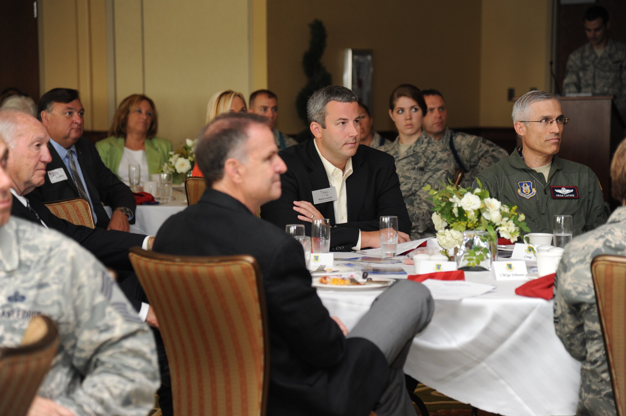 Biloxi community representatives, to include Patrick Lyons, Biloxi Chamber of Commerce board president, sit at the head table with Col. Craig LaFave, 403rd Wing acting wing commander, during the Biloxi Chamber of Commerce Morning Call Aug. 7, 2013, hosted by Keesler Air Force Base, Miss., at the Bay Breeze Event Center.  (U.S. Air Force photo by Kemberly Groue)