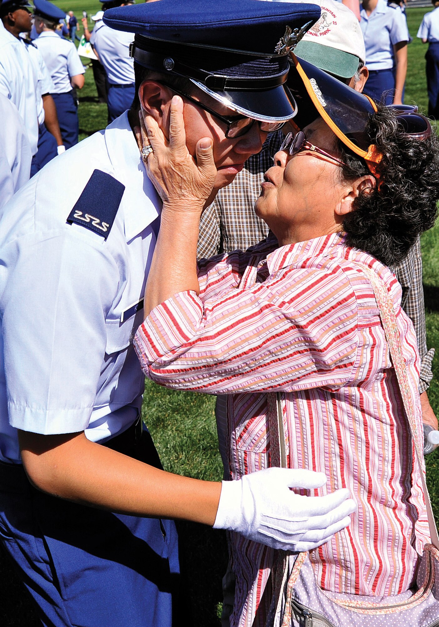 Cadet 4th Class Kim Yong Jun meets with members of his family after the Acceptance Day parade at the Air Force Academy Aug. 6, 2013. Kim is one of approximately 1,150 cadets who completed Basic Cadet Training, out of approximately 1,200 who entered BCT in June. (U.S. Air Force photo/Sam Lee)