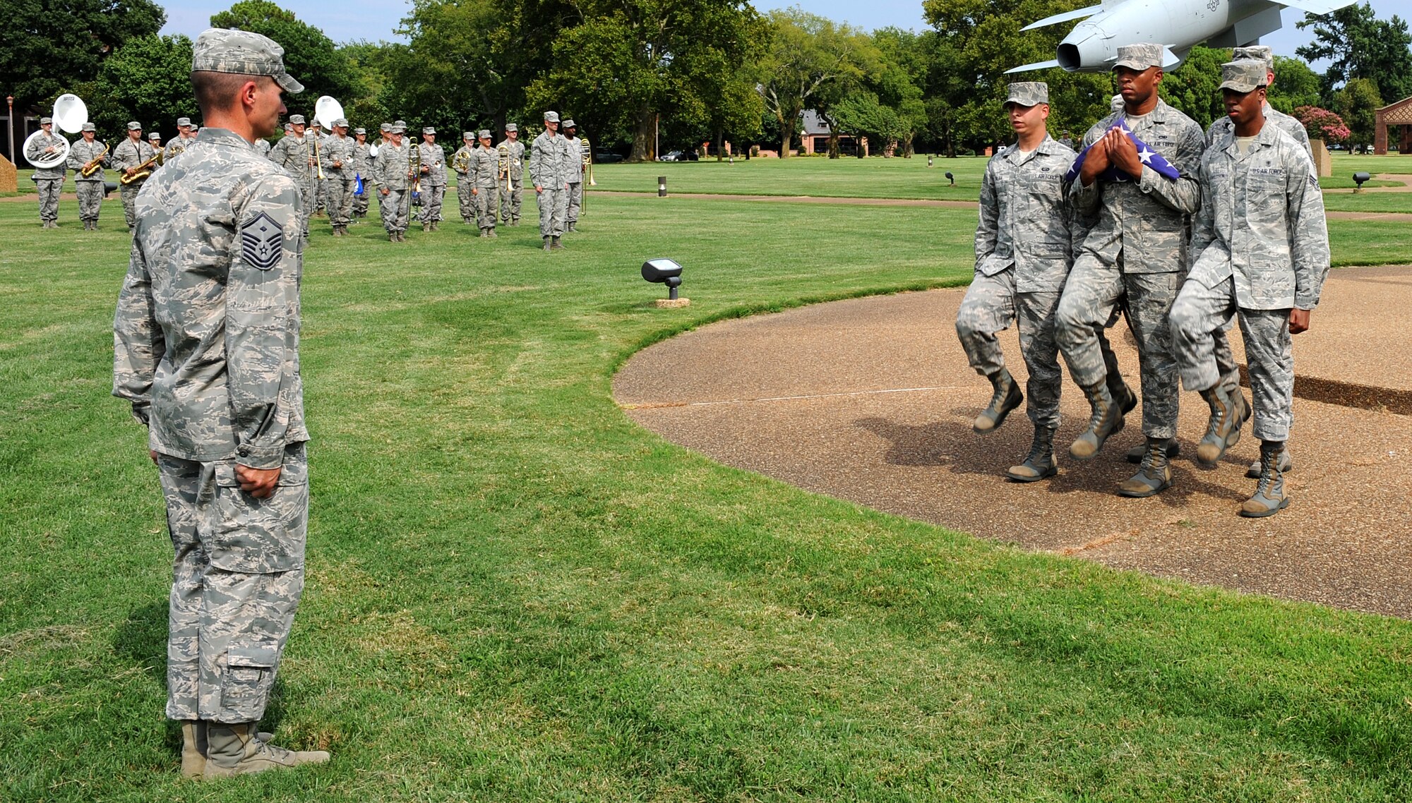 Airmen from Langley Air Force Base, Va., participate in the “We Are Family” base retreat ceremony, July 31, 2013. As part of the “We Are Family” campaign, Airmen show their support to prevent sexual assault. (U.S. Air Force photo by Senior Airman Brittany Paerschke-O’Brien/Released)
