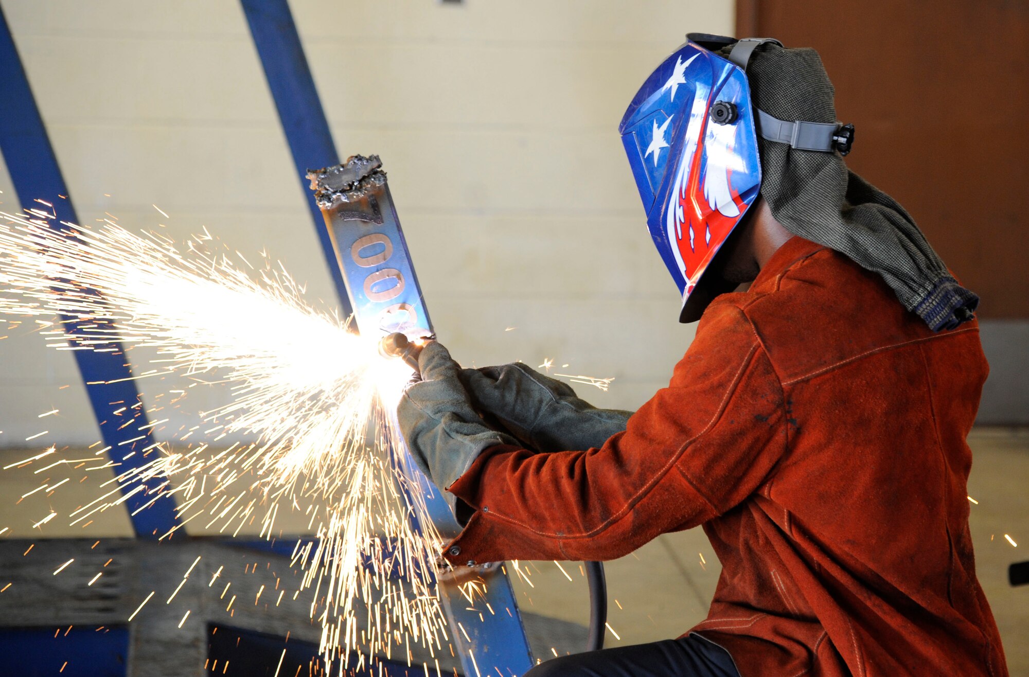 Airman 1st Class Jamil Dixon, 2nd Logistics Readiness Squadron vehicle maintenance journeyman, uses a plasma torch on Barksdale Air Force Base, La., Aug. 6, 2013. Dixon used the torch to disassemble a collision repair machine for scrap metal. (U.S. Air Force photo/Airman 1st Class Andrew Moua)