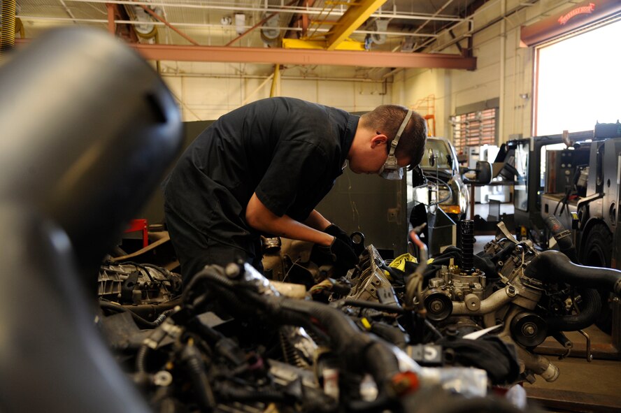 Airman 1st Class Daniel Ward, 2nd Logistics Readiness Squadron vehicle maintenance journeyman, begins disassembling an engine on Barksdale Air Force Base, La., Aug. 6, 2013. Ward disassembled the engine for parts during the installation of a new engine. (U.S. Air Force photo/Airman 1st Class Andrew Moua)