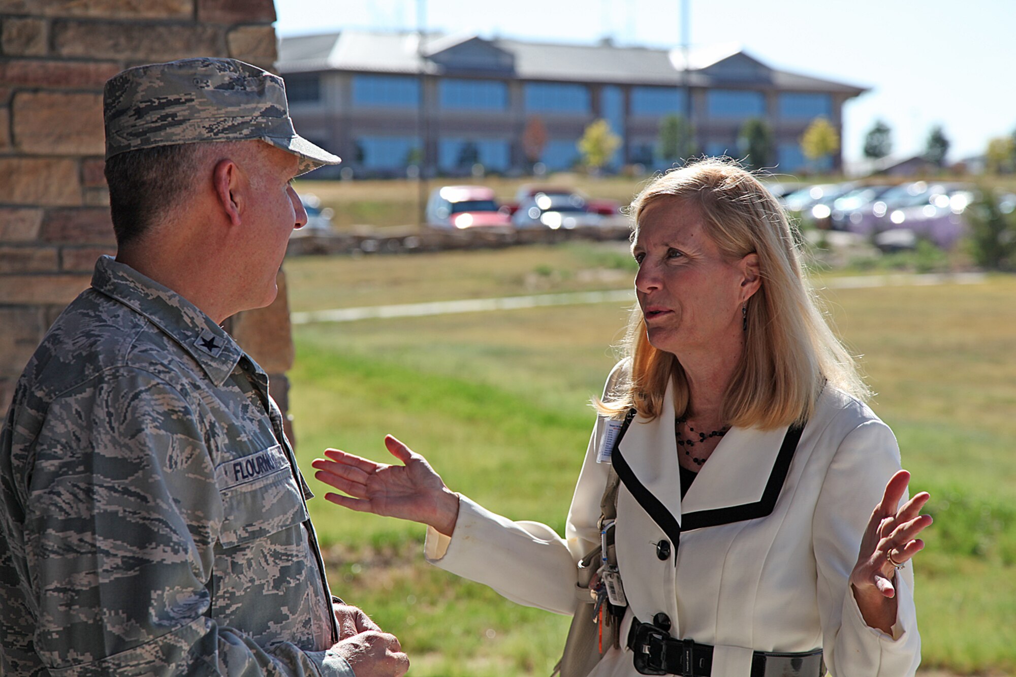 Cindy Kreutz, a Buckley Air Force Base honorary commander and chief executive officer and president of Spalding Rehabilitation Hospital in Aurora, Colo., visits with Brig. Gen. Jay Flournoy, Air Reserve Personnel Center commander.  The two welcomed new senior leadership from the 460th Space Wing to ARPC and provided a mission brief. Honorary commanders work closely with Buckley leaders to build strong relationships and gain a clear perspective of what the base brings to the community.(U.S. Air Force photo/Quinn Jacobson)