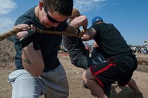 Senior Airman Rubye Coffey, 90th Missile Security Forces Squadron, competes on the 90th MSFS tug-of-war team in the annual F.E. Warren Air Force Base, Wyo., Frontiercade festivities Aug. 24, 2012. The 90th MSFS and the team from the 790th Missile Security Forces Squadron struggled back and forth for almost three-and-a-half minutes before the 90th MSFS fell. Representatives are signing up personnel from their respective organizations to participate in this year’s event. (U.S. Air Force photo by R.J. Oriez)