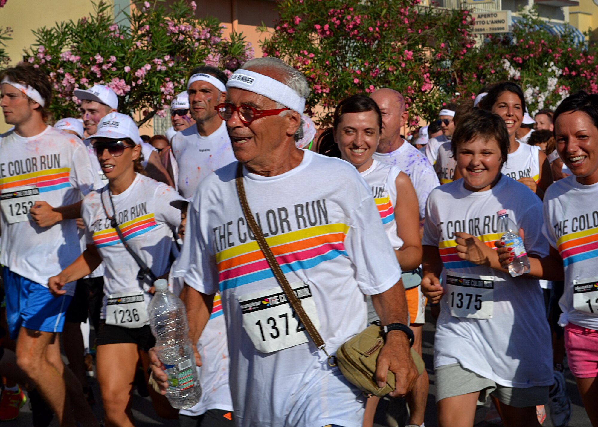 Runners take-off during The Color Run July 27, 2013, at Marina di Pietrasanta.  The Color Run is a noncompetitive 5k run in which all runners are covered with different colored powders at each kilometer mark. (Courtesy photo) 