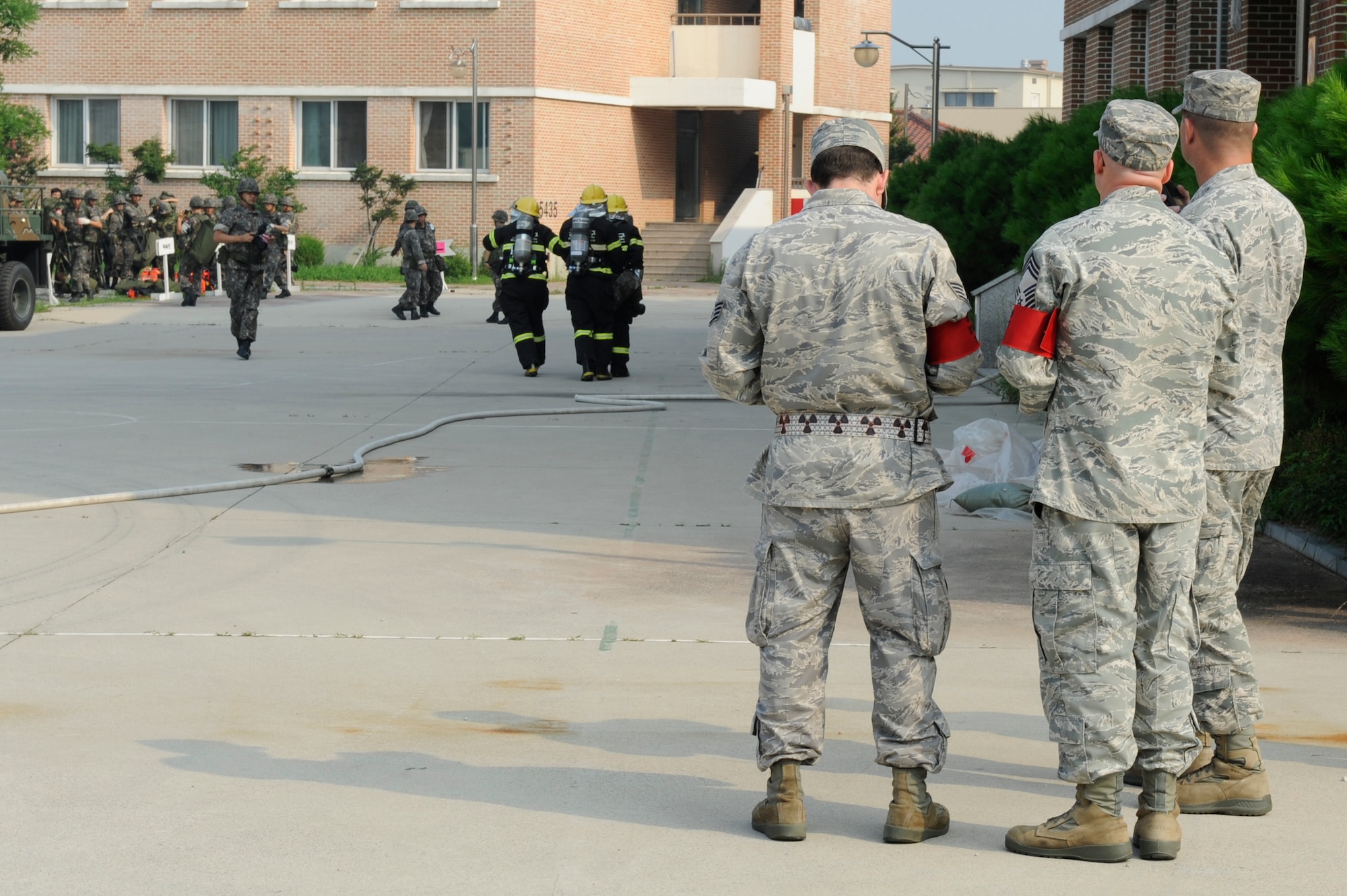KUNSAN AIR BASE, Republic of Korea – Eighth Fighter Wing Exercise Evaluation Team members observe Republic of Korea air force, 38th Fighter Group airmen responding in a mass casualty scenario during exercise Beverly Midnight 13-3, Aug. 7, 2013. The training allowed U.S. and ROK airmen to work on their communication and response procedures. (U.S. Air Force Photo by Staff Sgt. Tong Duong/Released)