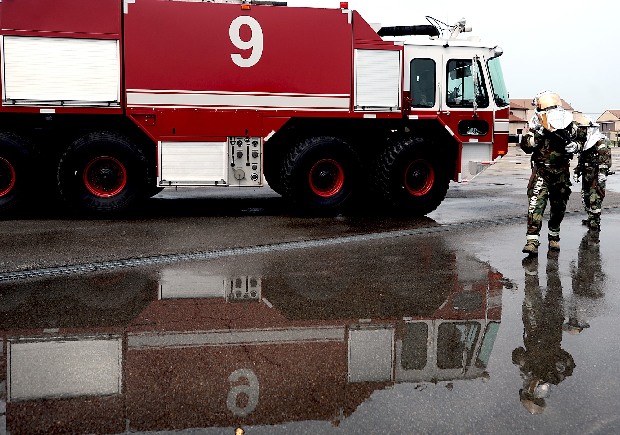 Fire fighters from the 51st Civil Engineer Squadron respond to a simulated fire as members of the Exercise Evaluation Team and 51st Fighter Wing Safety evaluate their procedures during Operational Readiness Exercise Beverly Midnight 13-03 at Osan Air Base, Republic of Korea, Aug. 7, 2013. Scenarios like these give Airmen a chance to hone wartime skills in a safe and structured environment in preparation for real-world contingencies. This is Osan’s fourth simulated wartime contingency exercise in 2013 that will test the base’s ability to defend and execute the mission in a heightened state of readiness. (U.S. Air Force photo/Staff Sgt. Sara Csurilla)