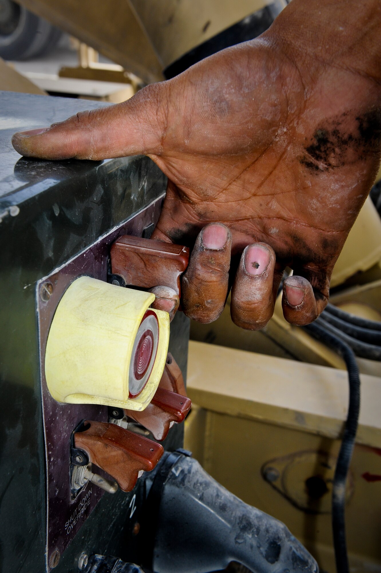 Senior Airman Maurice Kelly performs routine maintenance on a Tunner 60K aircraft cargo loader at the 379th Air Expeditionary Wing in Southwest Asia, July 31, 2013. Kelly is a 379th Expeditionary Logistics Readiness Squadron material handling and equipment mechanic deployed from Seymour Johnson Air Force Base, N.C. (U.S. Air Force photo/Senior Airman Benjamin Stratton)