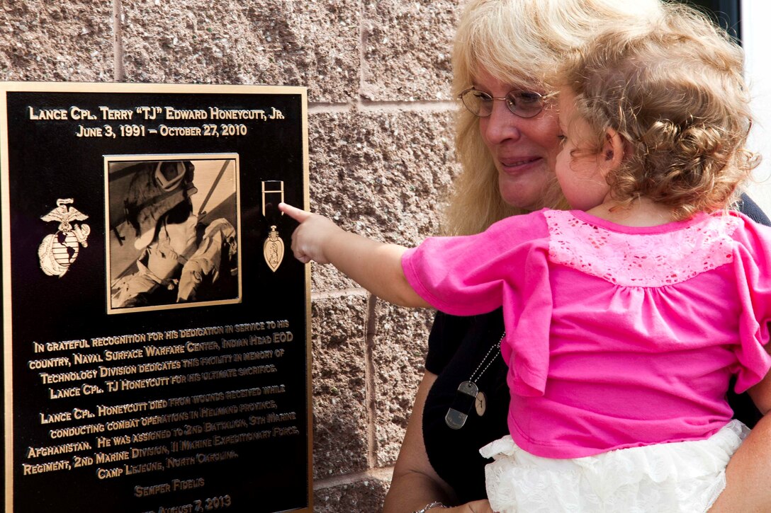 Christine Honeycutt took her grand daughter to visit a plaque at the Naval Surface Warfare Center Indian Head, Md. The Explosives Development Facility Administration Building and Change House was dedicated to Honeycutt's son.