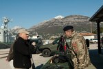 Brig. Gen. James Campbell, adjutant general for the Maine Army National Guard, examines one of the recently acquired weapons for the Montenegrin Naval Forces.