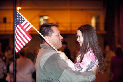 U.S. Air Force Senior Master Sgt. Nevin Mills, 140th Maintenance Squadron, spends time with his daughter after returning home at Buckley Air Force Base Colo., Jan 10, 2013.