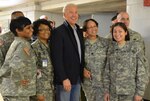 Vice President Joe Biden shares a photo op with D.C. National Guard Soldiers and Airmen at the D.C. National Guard Armory Jan. 19, 2013.