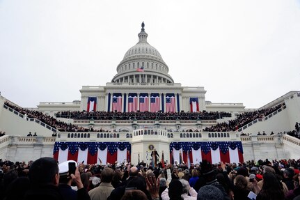 Members of the U.S. armed forces, members of Congress, security personnel, and spectators cheer for the arrival of President Barack Obama during the 57th Presidential Inauguration in Washington, D.C., Jan. 21, 2013.