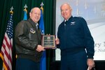 Lt. Gen. Harry M. Wyatt III, the director of the Air National Guard, presents Col. John D. Slocum, the director of ANG Safety, with the Air Force Safety Hall of Fame Award during a town hall meeting Jan. 22, 2013 at Joint Base Andrews, Md.