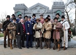Kentucky National Guard historian John Trowbridge (first row, second from left) and adjutant general of Kentucky Maj. Gen. Edward W. Tonini stand with Kentucky Militia re-enactors at a Kentucky Memorial established in 1904 to honor the fallen Soldiers of Kentucky during the Battle of the River Raisin in Monroe, Mich., Jan 19, 2013.