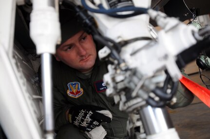 Tech. Sgt. David Cochran, a crew chief and ground safety noncommissioned officer with the 113th Wing's Aerospace Control Alert Detachment, performs a visual inspection of the wheel well components of an F-16 Fighting Falcon at Joint Base Andrews, Md., Jan. 24, 2013. Cochran is one of several aircraft maintainers responsible for ensuring that the aircraft is 100-percent ready to go at a moment's notice, 24-hours a day, seven days a week. The mission of the aircraft is intercepting and protecting the national capital region from any potential airborne threats.