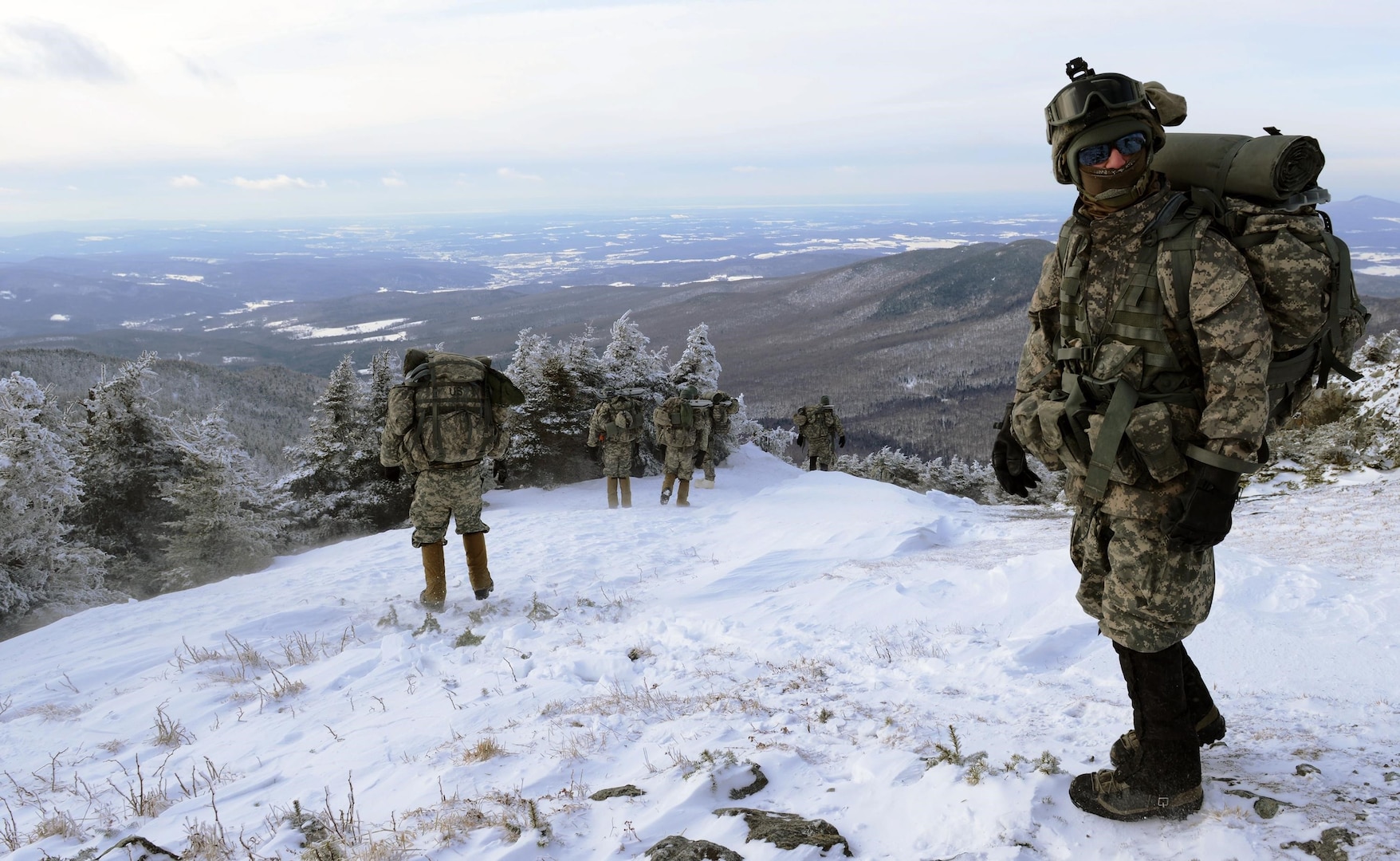 Soldiers with the Vermont Army National Guard's Troop A, 1st Squadron, 172nd Cavalry Regiment, make their way along Jay Peak, Vermont during an overnight reconnaissance training mission. The Soldiers tested their cold-weather survival skills while also training on a variety of reconnaissance and movement tasks and techniques.
