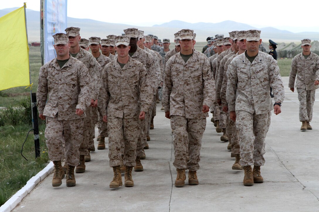 U.S. Marines with 3rd Battalion, 3rd Marine Regiment, III Marine Expeditionary Force, march in formation during the opening ceremony of Exercise Khaan Quest in Five Hills Training Area, Mongolia, August 2, 2013. Khaan Quest is an annual multinational exercise sponsored by the U.S. and Mongolia, and it is designed to strengthen the capabilities of U.S., Mongolian and other nations’ forces in international peace support operations.(U.S. Marine Corps Photo by Sgt John M. Ewald/released)