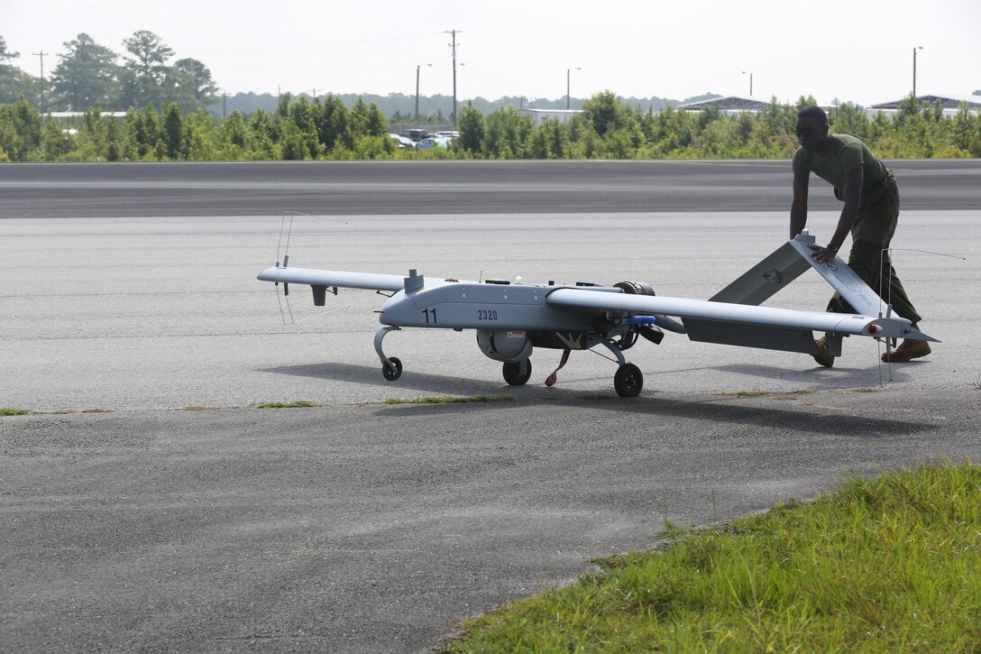 Lance Cpl. Kareem Clopton, an avionics maintenance technician with VMU-2, brings the RQ-7B Shadow back to the taxiway shortly after landing Aug. 2. 

